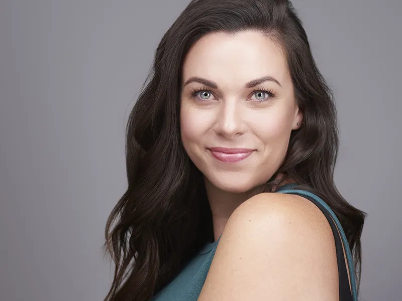 Professional LinkedIn headshot with soft natural curls for personal branding photography